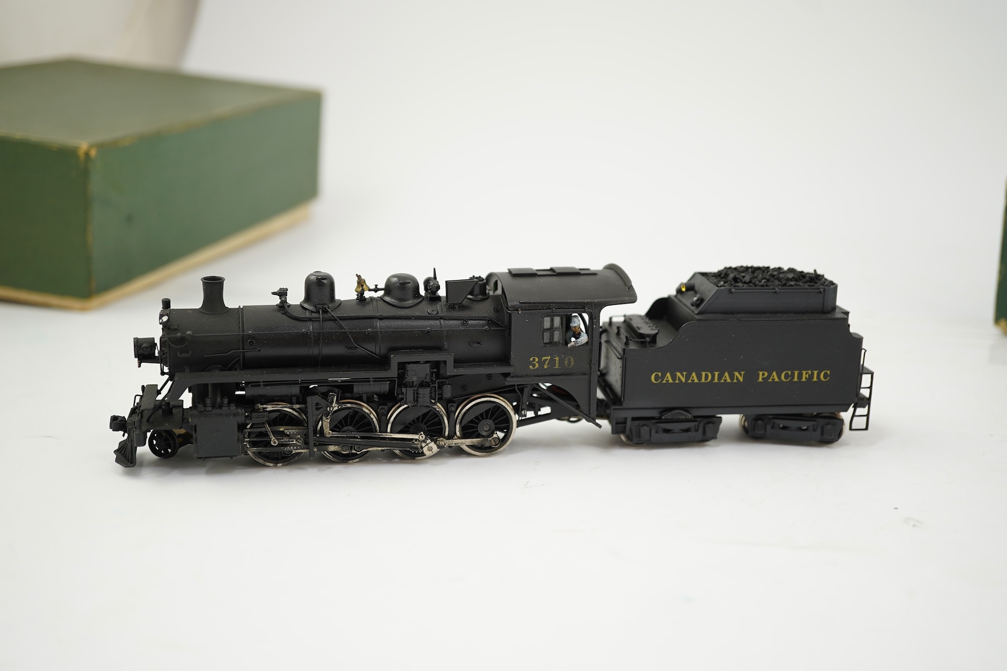 Two boxed HO gauge Canadian Pacific locomotives; a Toby of Japan model of 2412, 4-6-2 locomotive with bogie tender, together with a United Scale Models 3710, 2-8-0 locomotive with bogie tender, both powered for two rail
